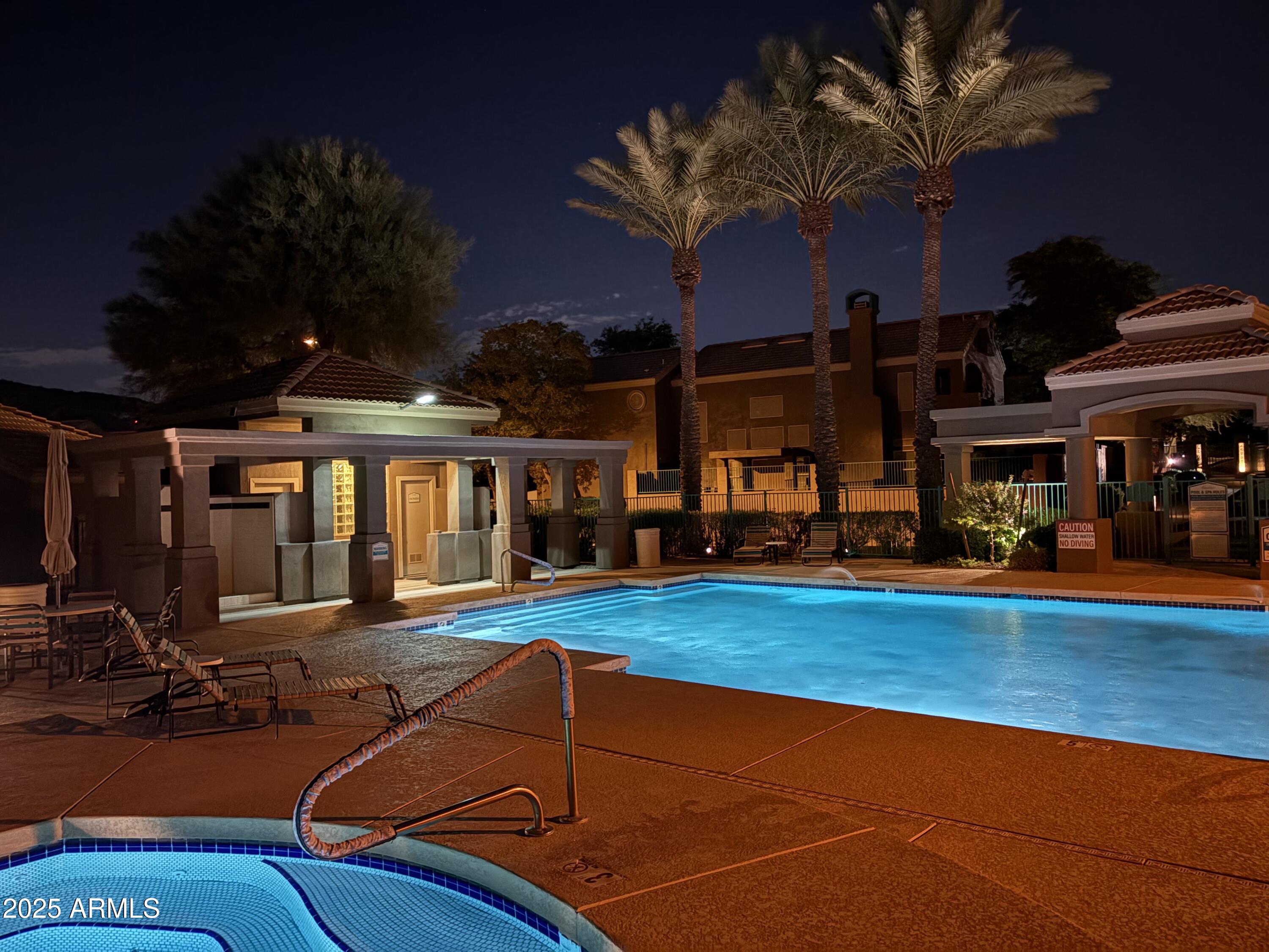 1139 East Frye Road Phoenix, AZ 85048 - Photo 10 of 17 a view of a swimming pool with seating area
