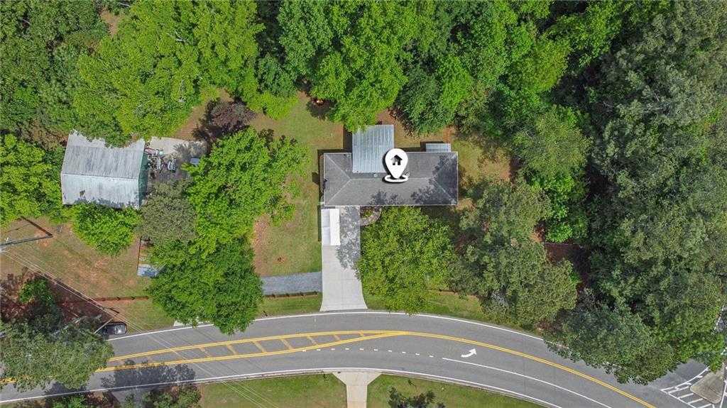 3852 Drew Campground Road Cumming, GA 30040 - Photo 1 of 41 an aerial view of a house with a yard