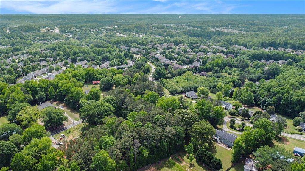 3852 Drew Campground Road Cumming, GA 30040 - Photo 13 of 41 an aerial view of residential houses with outdoor space and trees