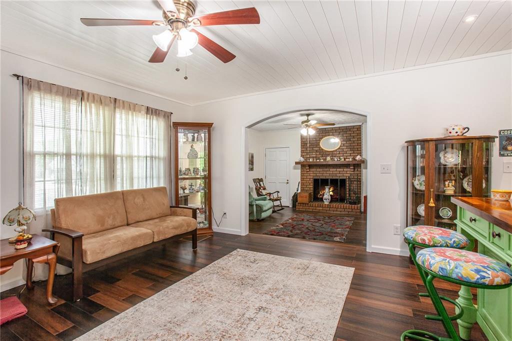 3852 Drew Campground Road Cumming, GA 30040 - Photo 17 of 41 a living room with furniture and a fireplace