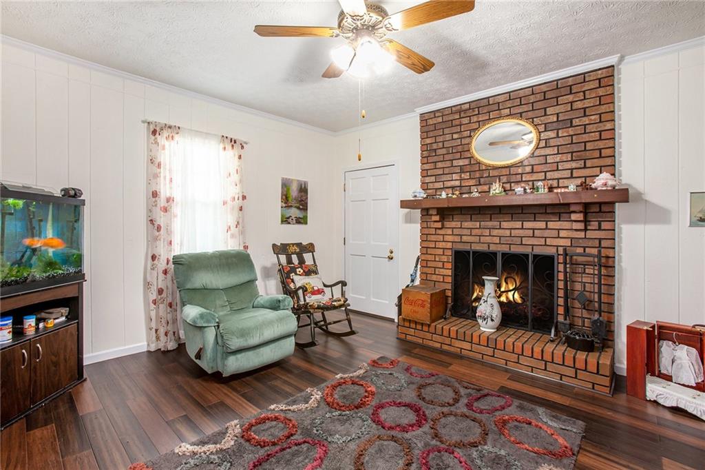 3852 Drew Campground Road Cumming, GA 30040 - Photo 19 of 41 a living room with furniture and a fireplace