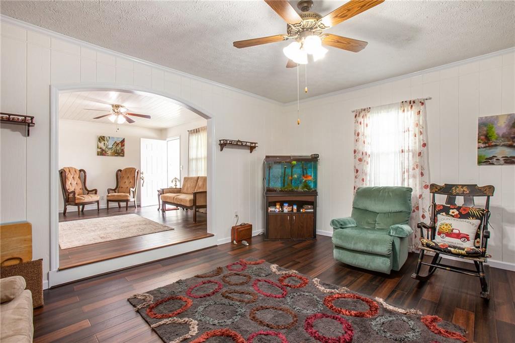 3852 Drew Campground Road Cumming, GA 30040 - Photo 20 of 41 a living room with furniture and a rug