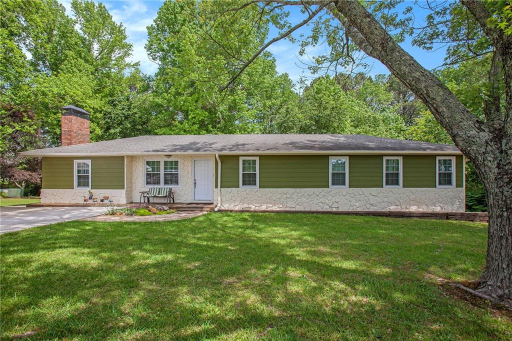 3852 Drew Campground Road Cumming, GA 30040 - Photo 2 of 41 a front view of a house with a garden