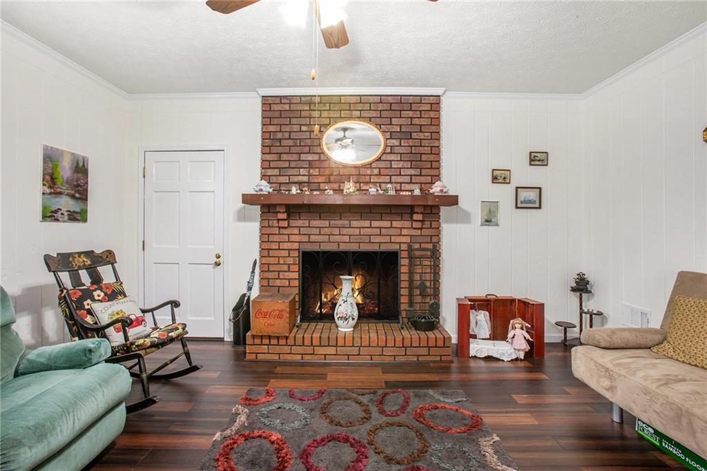 3852 Drew Campground Road Cumming, GA 30040 - Photo 21 of 41 a living room with furniture and a fireplace