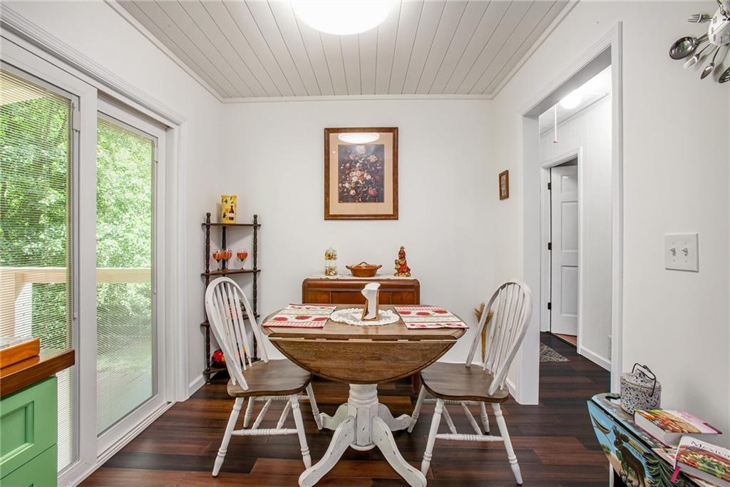 3852 Drew Campground Road Cumming, GA 30040 - Photo 22 of 41 a view of a dining room with furniture window and wooden floor