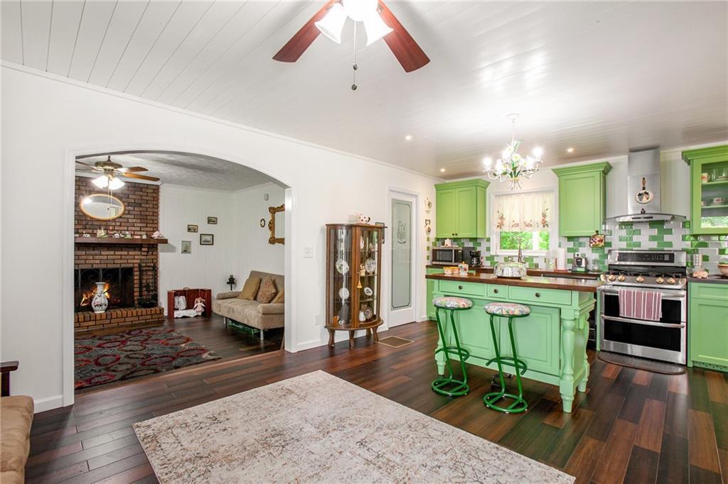 3852 Drew Campground Road Cumming, GA 30040 - Photo 23 of 41 a living room with furniture and a fireplace