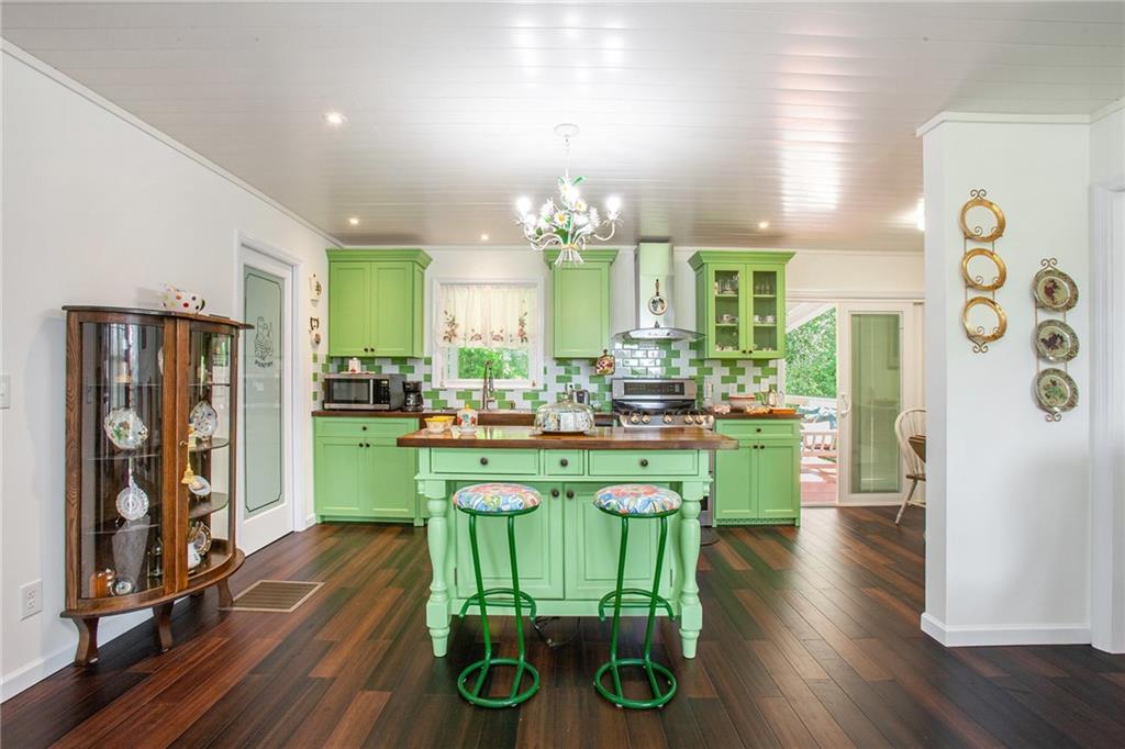 3852 Drew Campground Road Cumming, GA 30040 - Photo 24 of 41 a kitchen with cabinets and wooden floor