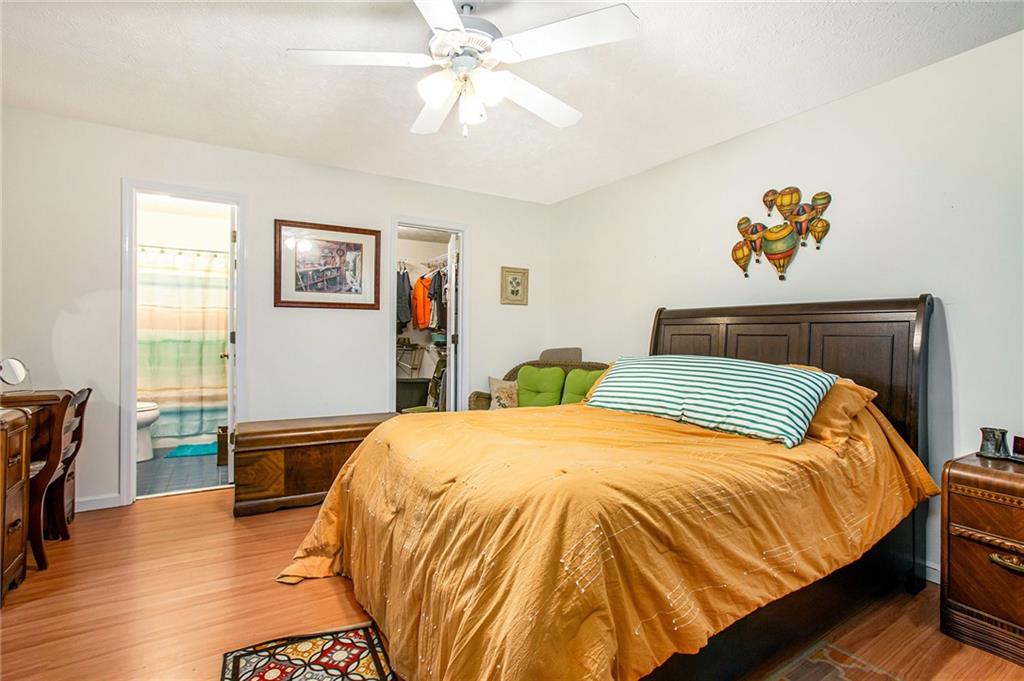3852 Drew Campground Road Cumming, GA 30040 - Photo 28 of 41 a bedroom with a bed and wooden floor