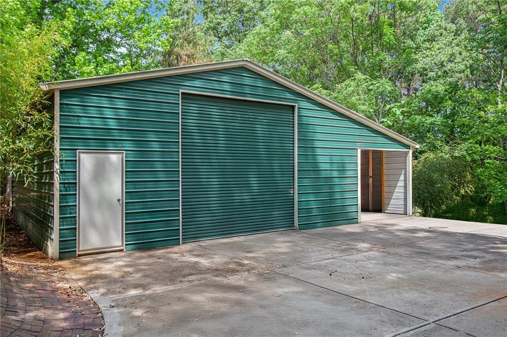 3852 Drew Campground Road Cumming, GA 30040 - Photo 3 of 41 a front view of a house with a garage