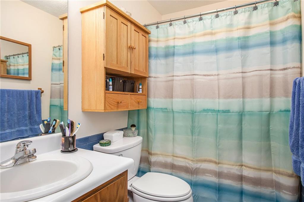 3852 Drew Campground Road Cumming, GA 30040 - Photo 31 of 41 a bathroom with a sink toilet and shower