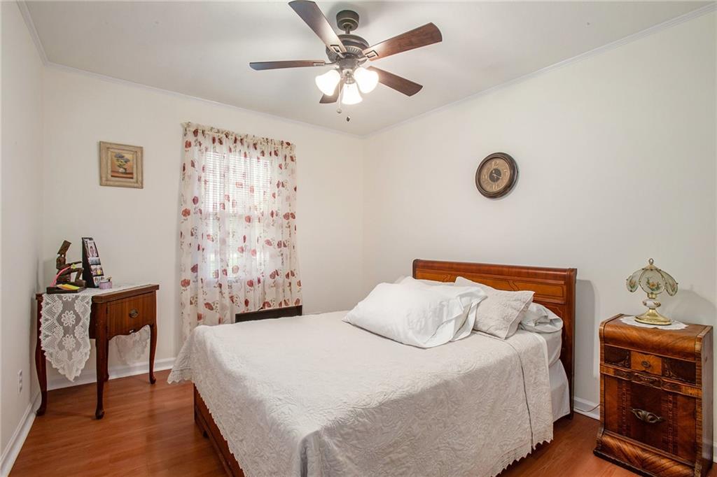 3852 Drew Campground Road Cumming, GA 30040 - Photo 32 of 41 a bedroom with a bed and a chandelier