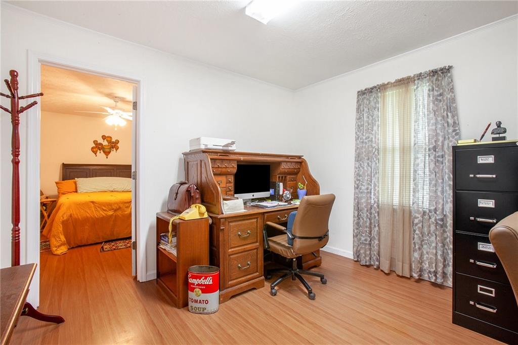 3852 Drew Campground Road Cumming, GA 30040 - Photo 34 of 41 a living room with furniture and a flat screen tv