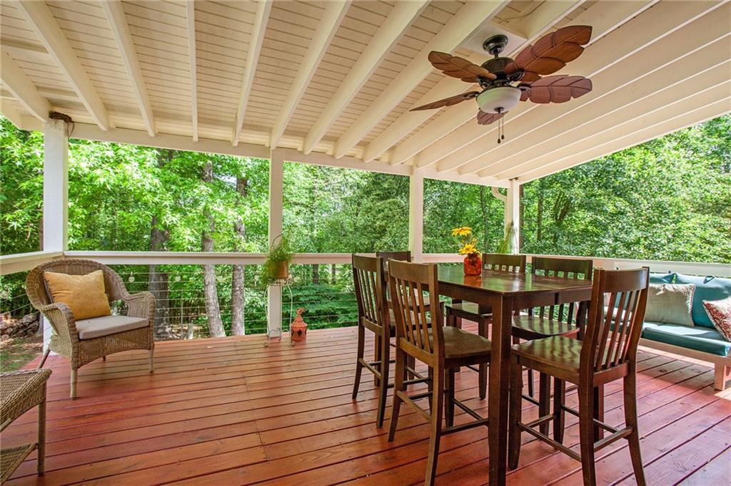 3852 Drew Campground Road Cumming, GA 30040 - Photo 37 of 41 a view of a patio with a dining table and chairs