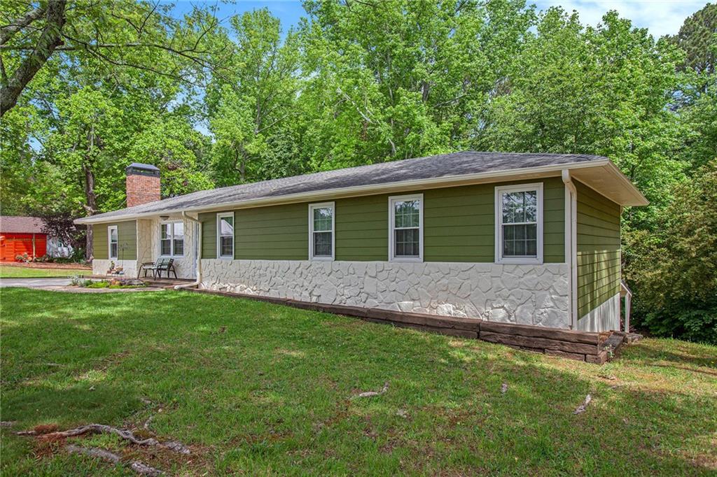 3852 Drew Campground Road Cumming, GA 30040 - Photo 6 of 41 a front view of house with yard and green space