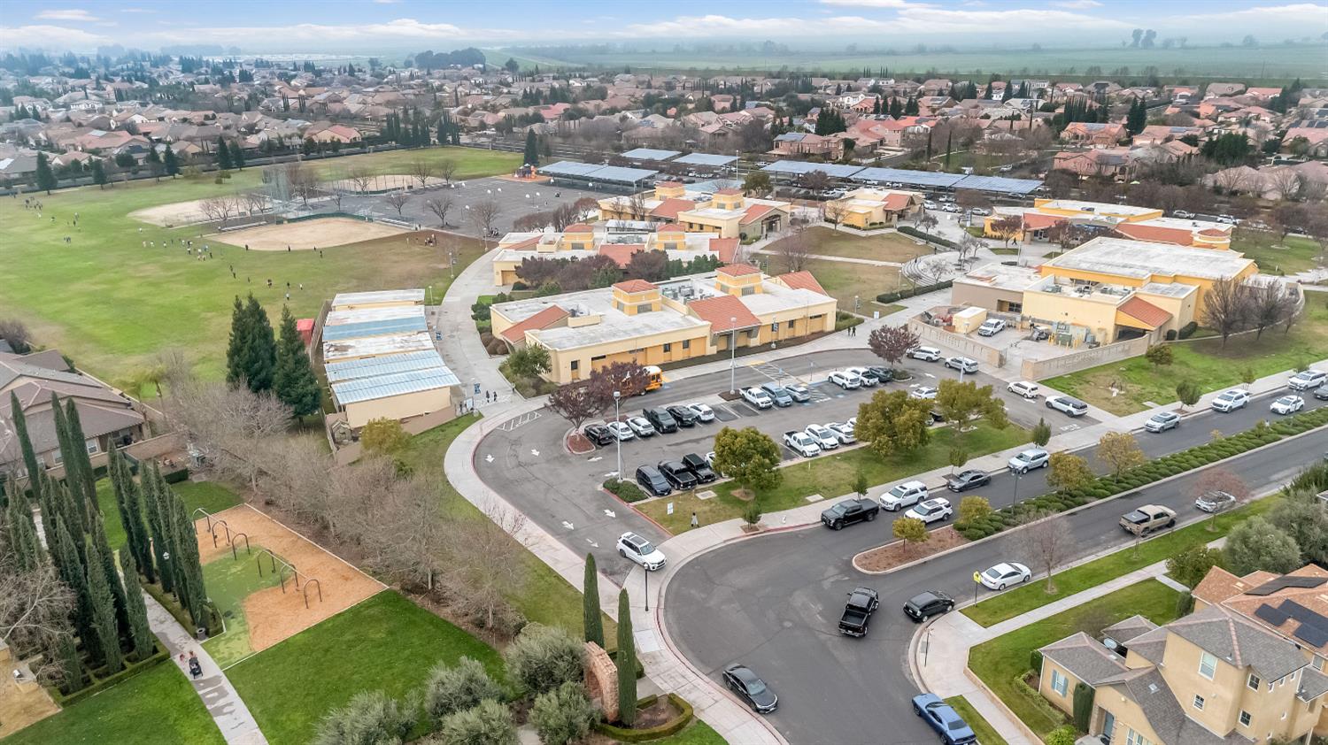 1503 North Reunion Way Clovis, CA 93619 - Photo 25 of 25 an aerial view of a house with outdoor space and lake view in back