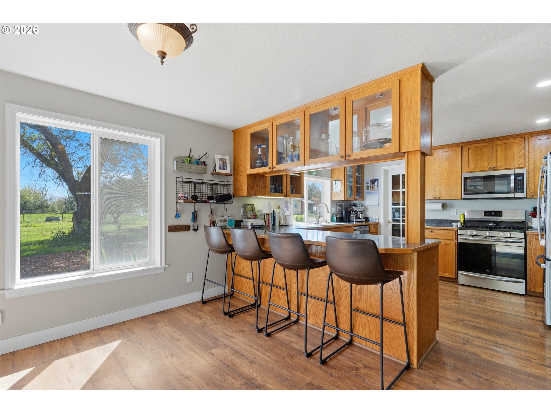 23032 Northeast Hagey Road Dundee, OR 97115 - Photo 11 of 42 a dining room with furniture and a floor to ceiling window