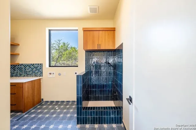 a bathroom with a sink and a shower