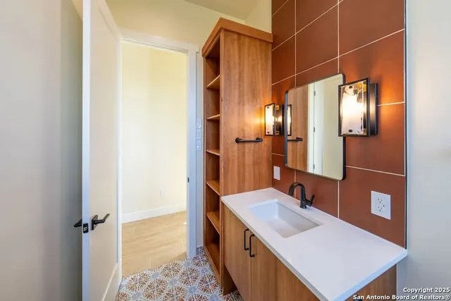 an aerial view of a houses with a yard