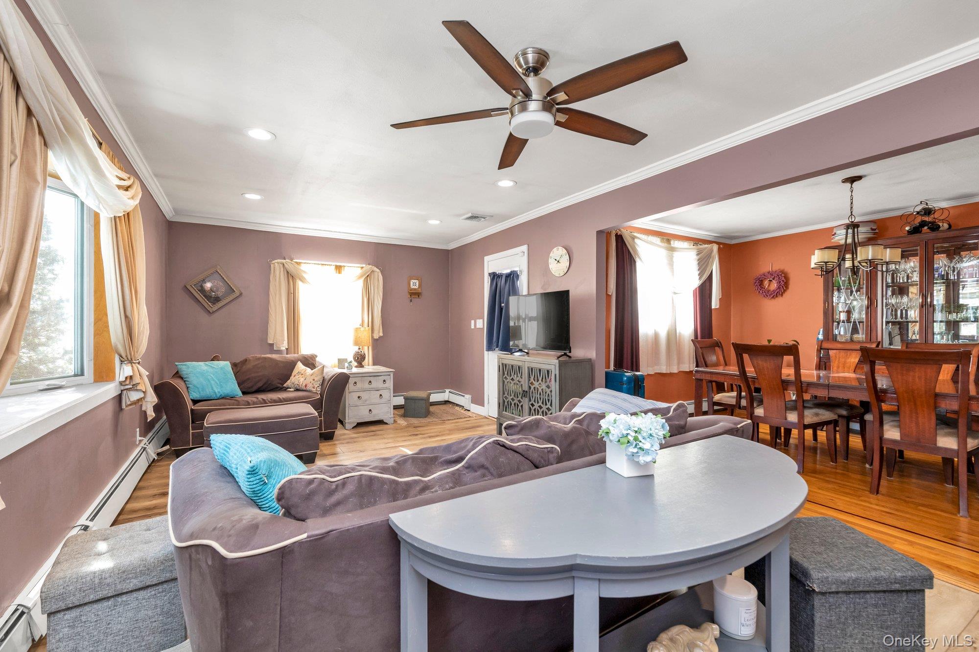 412 Wellington Road East Meadow, NY 11554 - Photo 2 of 15 a living room with furniture and a large window