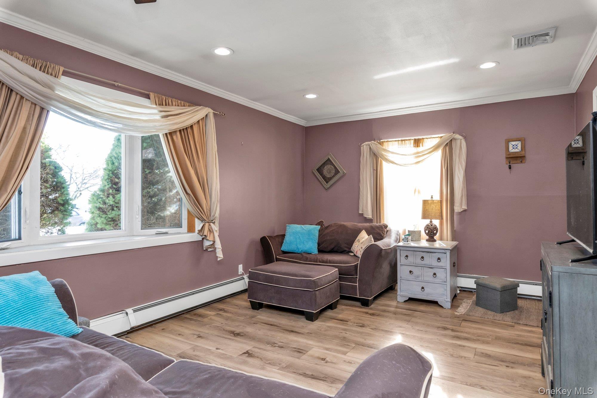 412 Wellington Road East Meadow, NY 11554 - Photo 3 of 15 a living room with furniture and a window
