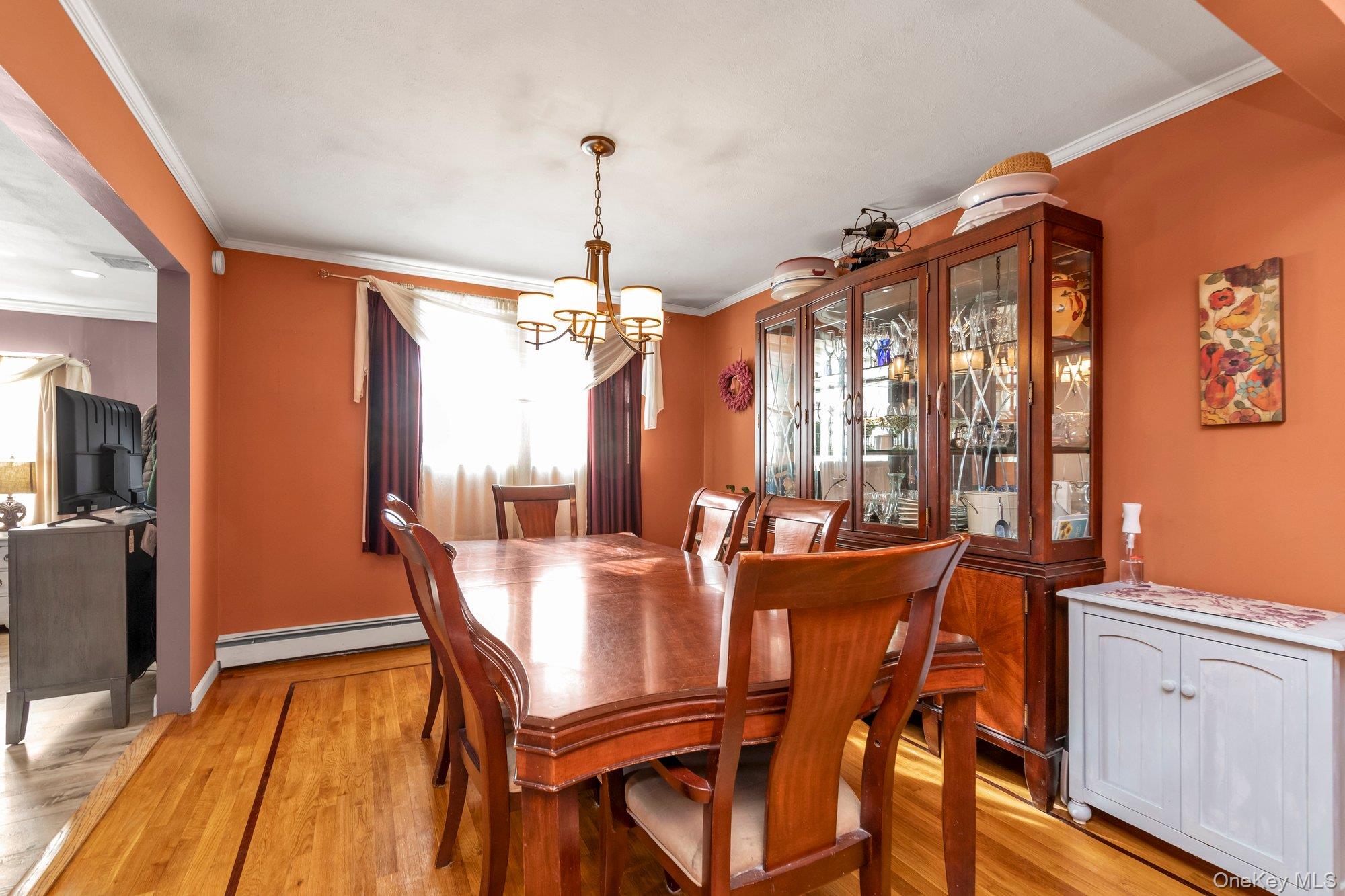 412 Wellington Road East Meadow, NY 11554 - Photo 5 of 15 a view of a dining room with furniture window and wooden floor