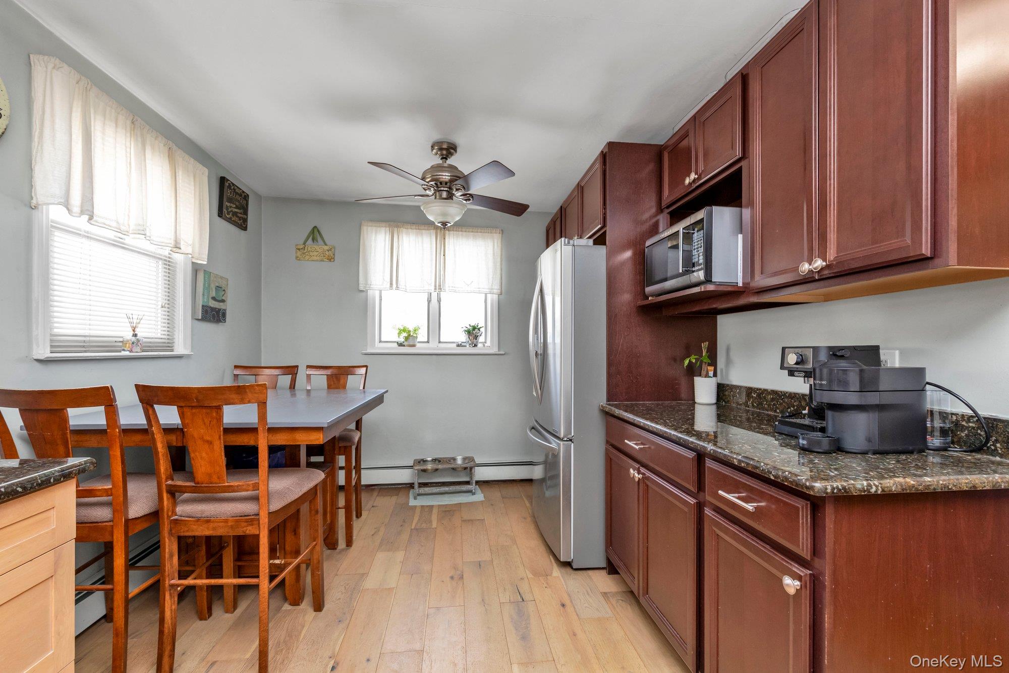 412 Wellington Road East Meadow, NY 11554 - Photo 9 of 15 a kitchen with stainless steel appliances granite countertop a sink and cabinets