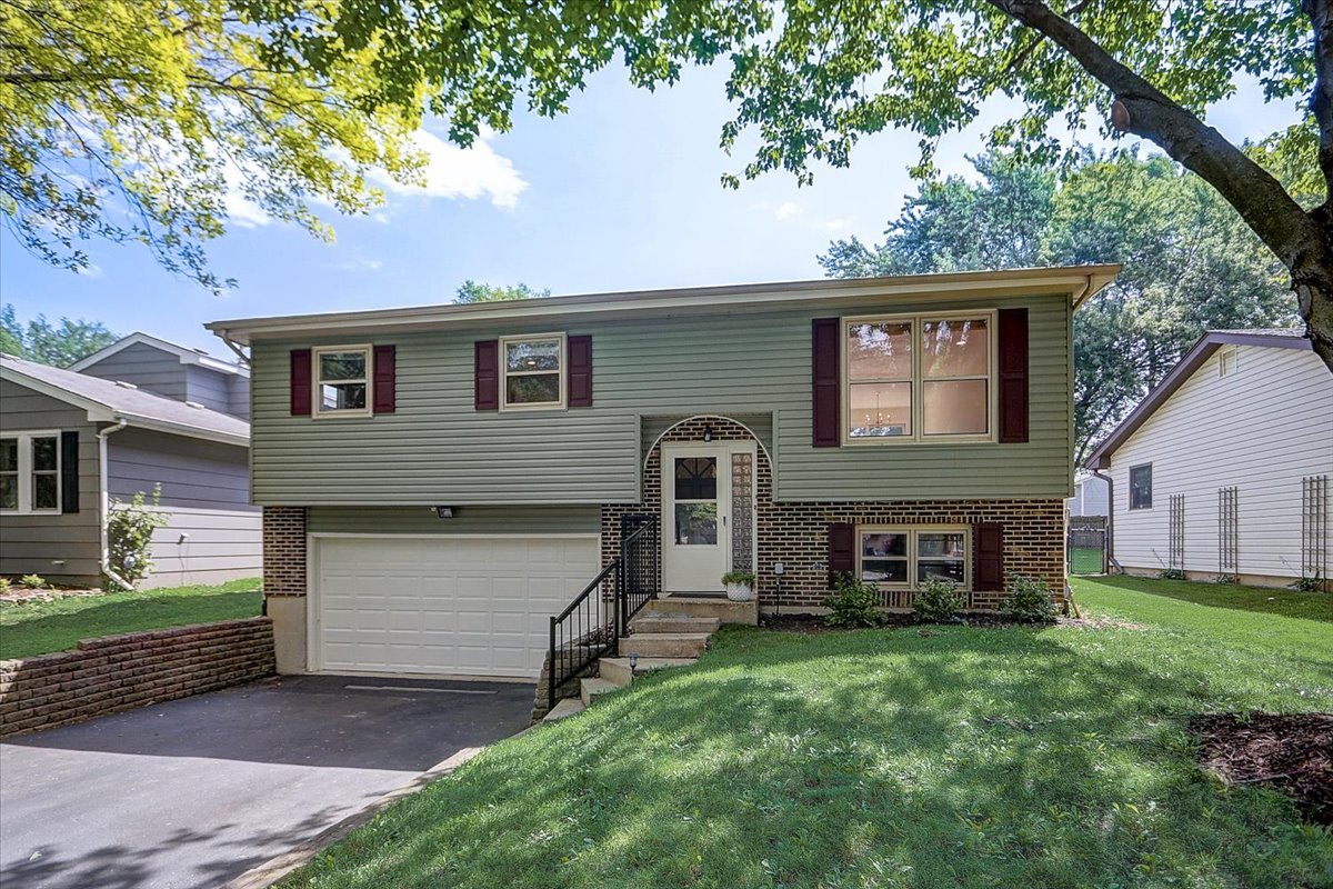S041 Page Street Winfield, IL 60190 - Photo 1 of 32 a front view of a house with a garden