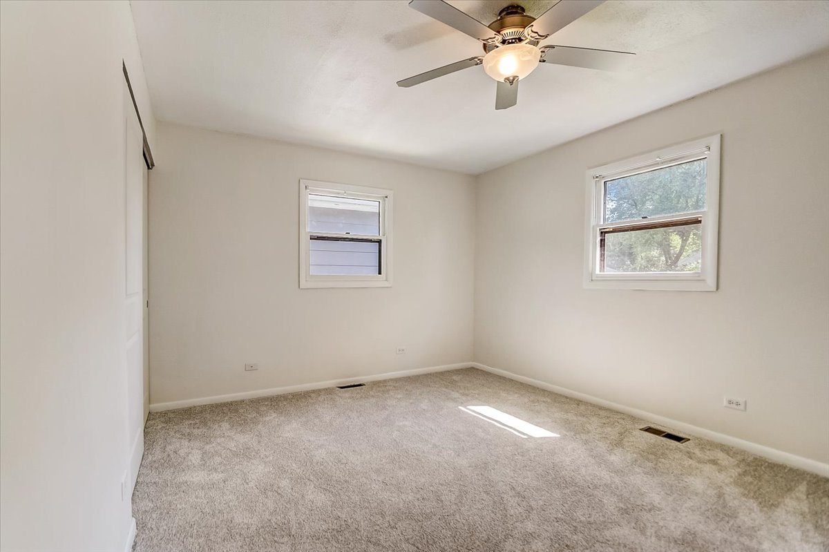 S041 Page Street Winfield, IL 60190 - Photo 13 of 32 wooden floor in an empty room with a window