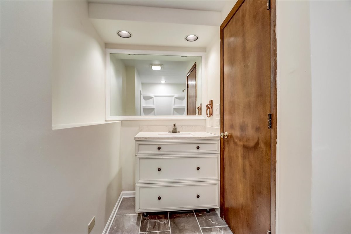 S041 Page Street Winfield, IL 60190 - Photo 21 of 32 a bathroom with a sink mirror and a toilet