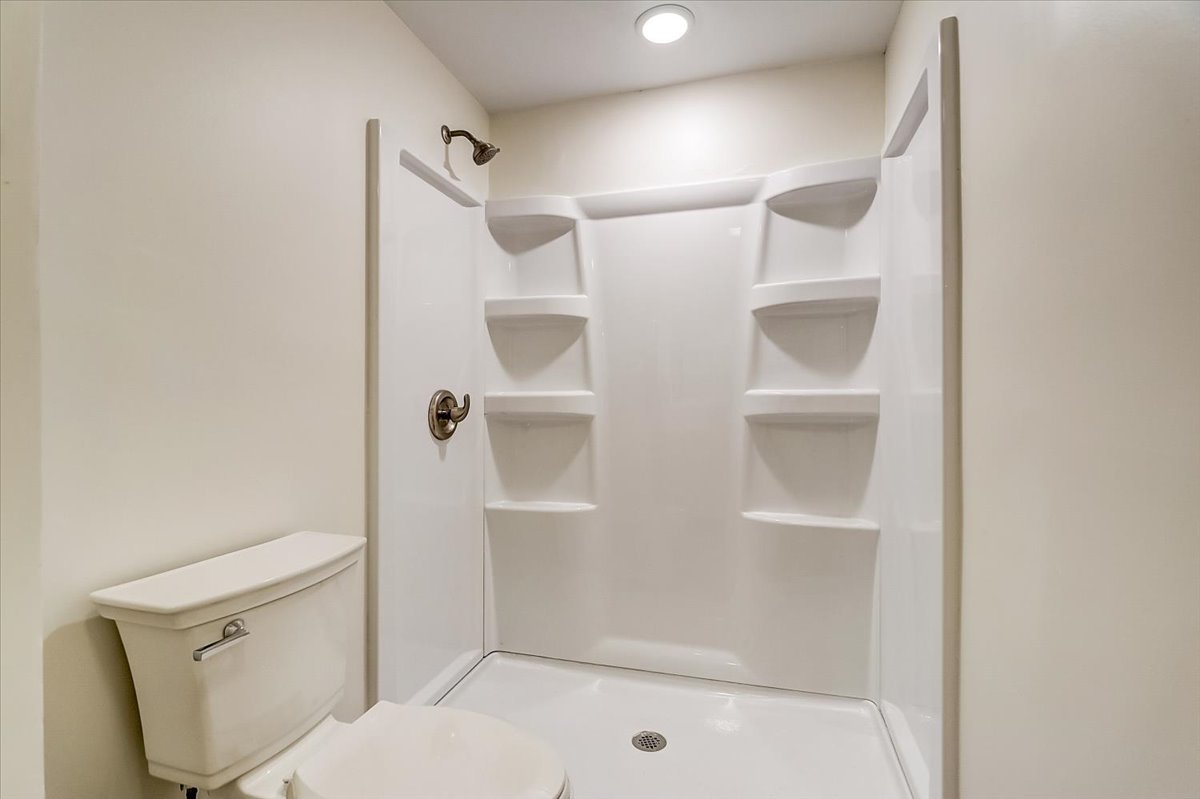 S041 Page Street Winfield, IL 60190 - Photo 22 of 32 a bathroom with a shower and toilet
