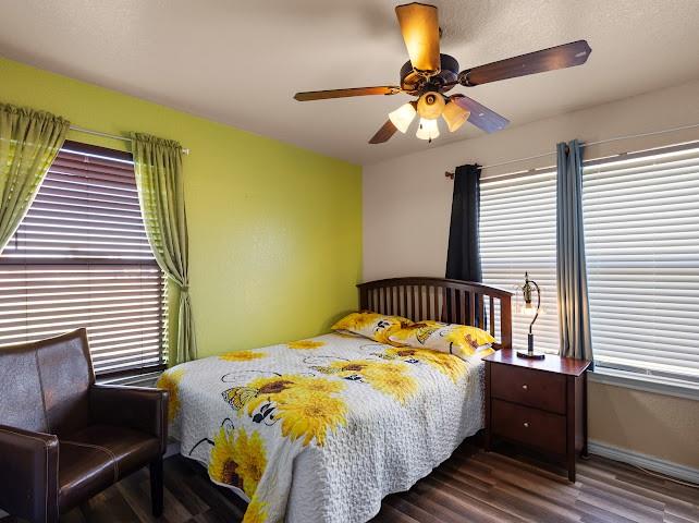 792 County Road 4213 Decatur, TX 76234 - Photo 24 of 32 Bedroom featuring wood finished floors and ceiling fan