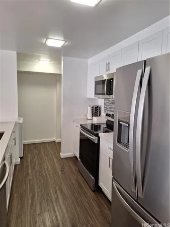 a kitchen with a refrigerator stove and sink