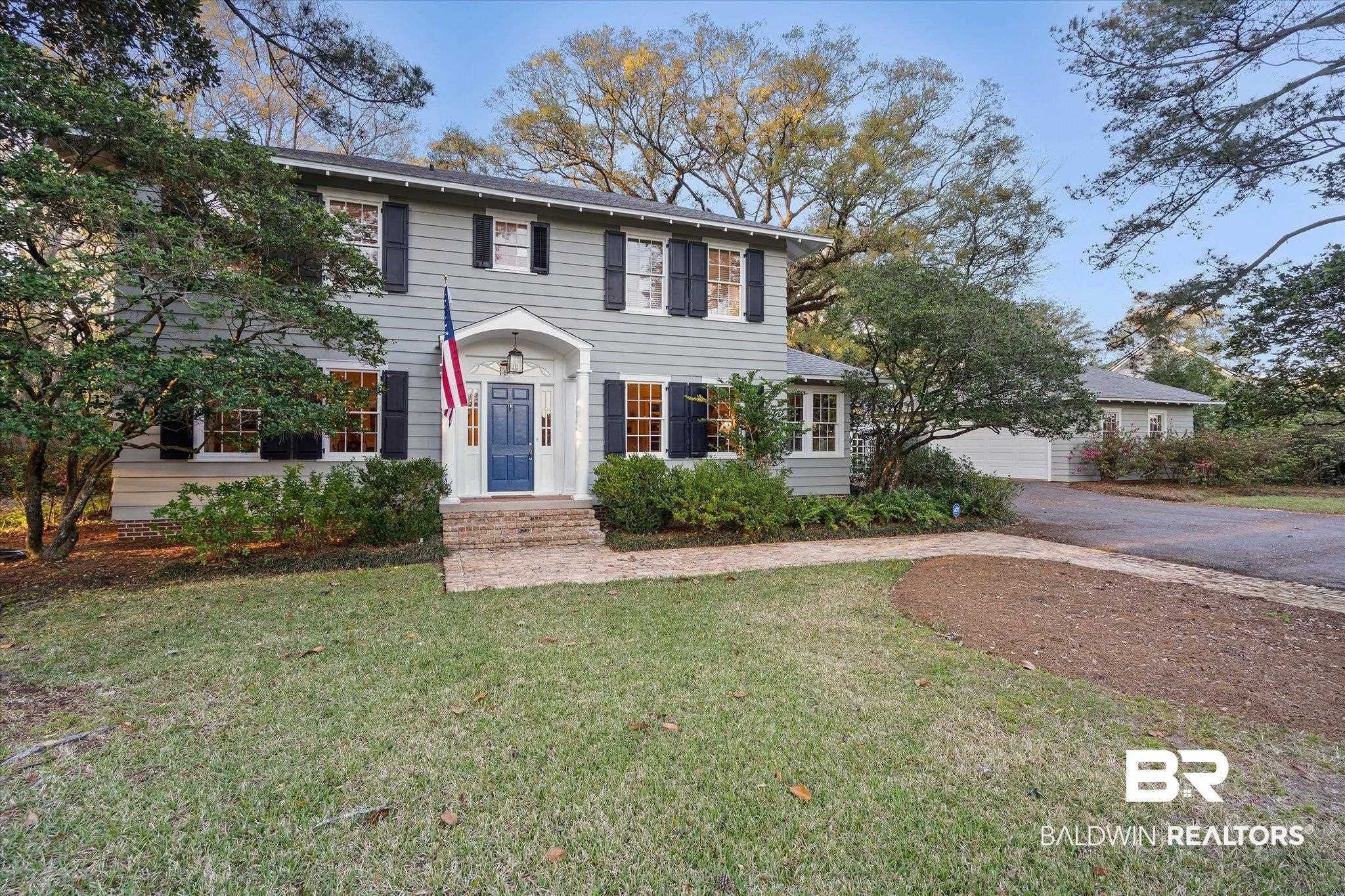 2 Westgate Road Mobile, AL 36608 - Photo 3 of 63 Colonial home with a front yard, driveway, and an attached garage