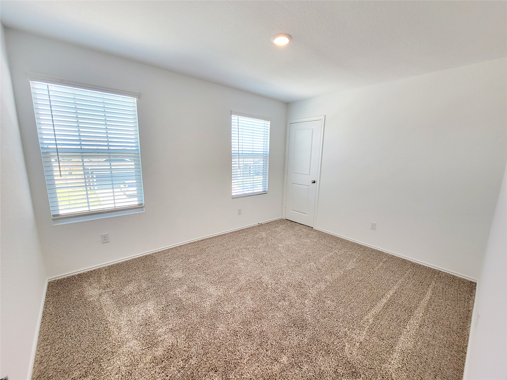 309 Bullhead Road Bastrop, TX 78602 - Photo 7 of 8 Empty room featuring carpet flooring and baseboards