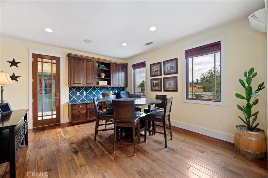 16420 Rocky Glen Road Perris, CA 92570 - Photo 23 of 74 a view of a dining room with furniture window and wooden floor