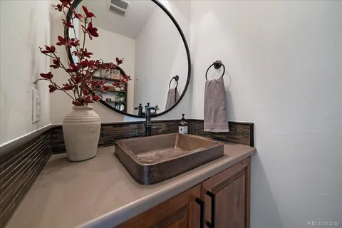 a kitchen that has a sink and a stove