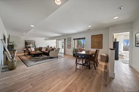 a living room with fireplace furniture and a flat screen tv