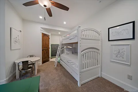 a bathroom with a sink a toilet a mirror and shower