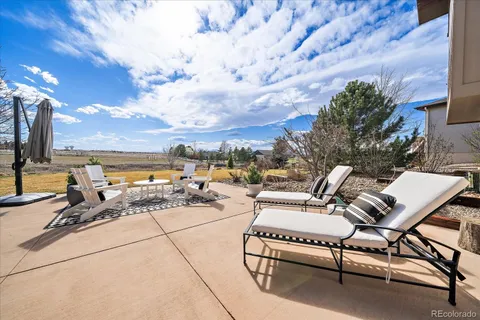 a view of a balcony with furniture