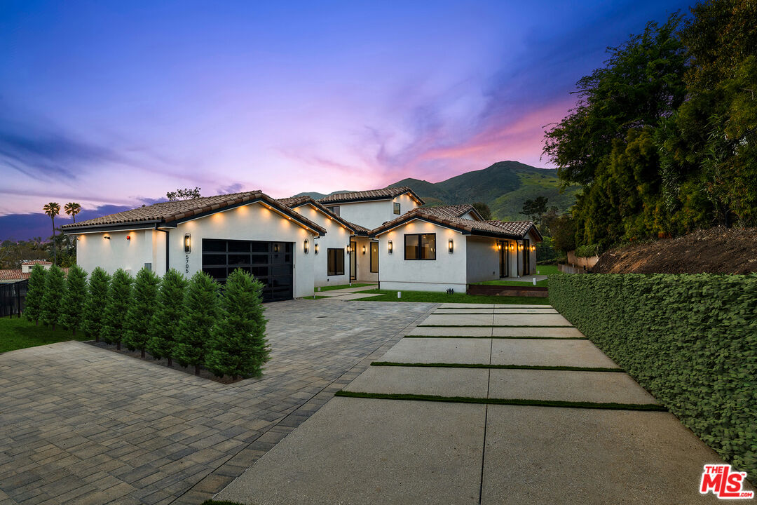 5705 Busch Drive Malibu, CA 90265 - Photo 1 of 57 a front view of a house with a yard