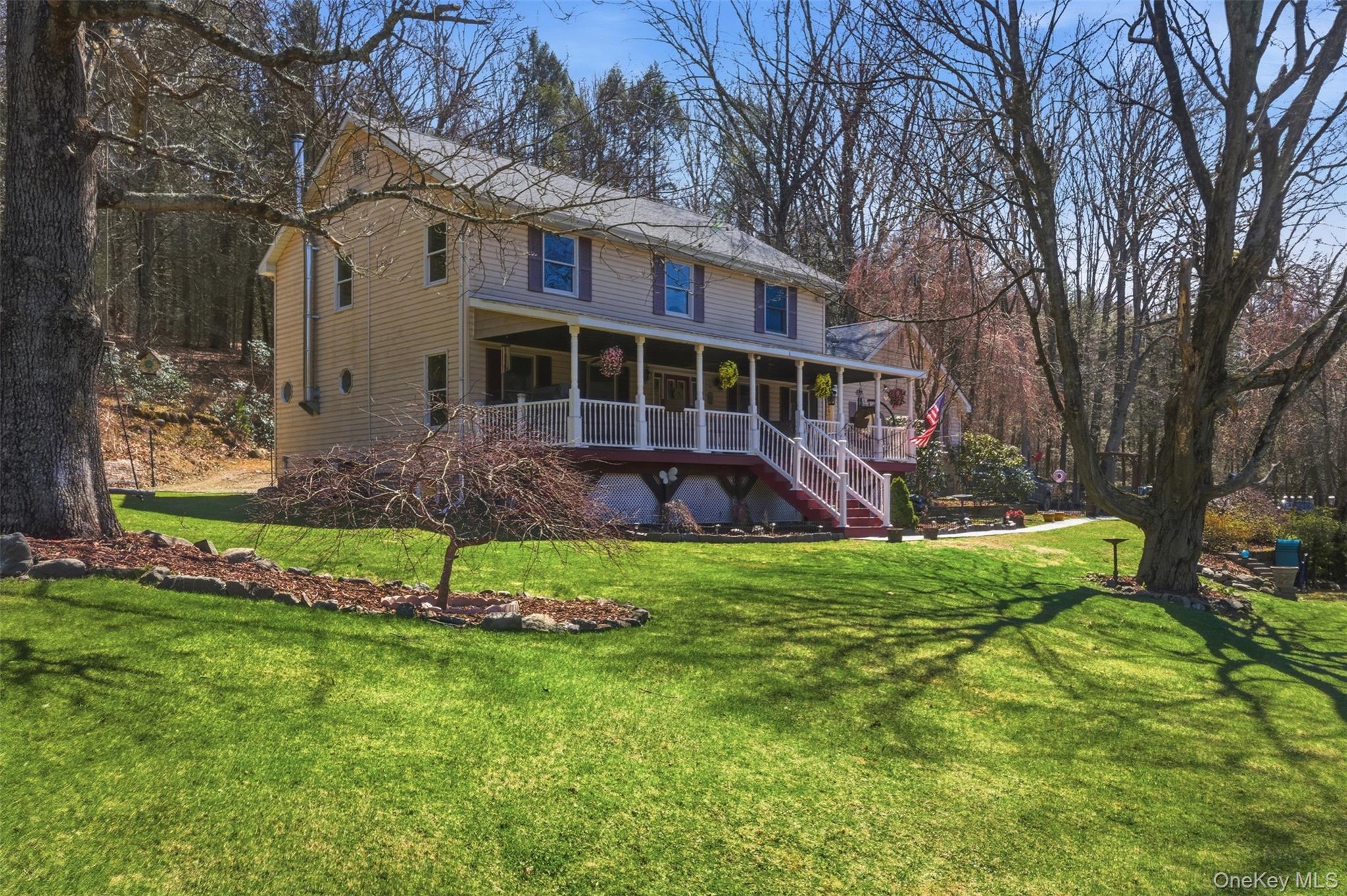 1285 Lakes Road Monroe, NY 10950 - Photo 37 of 45 a view of a house with a yard and plants