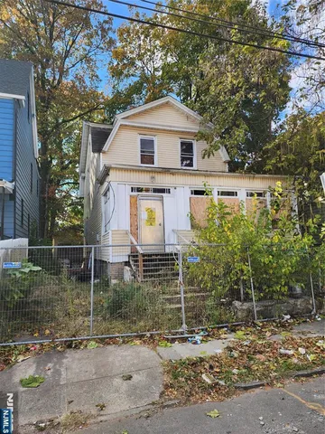a aerial view of a house with a yard
