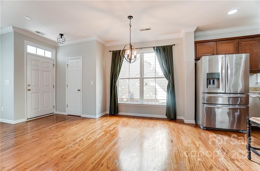 3438 Richard's Crossing Fort Mill, SC 29708 - Photo 14 of 41 a view of empty room with a kitchen and windows