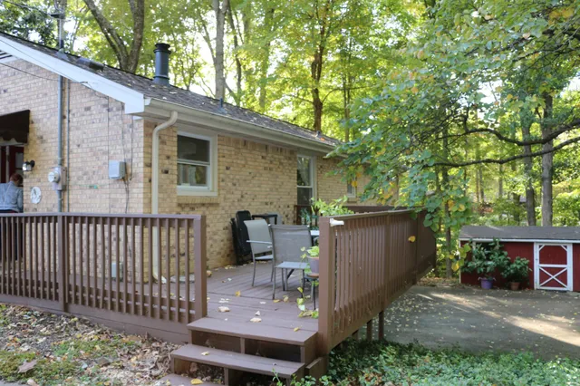 a kitchen with granite countertop a stove a sink and a microwave