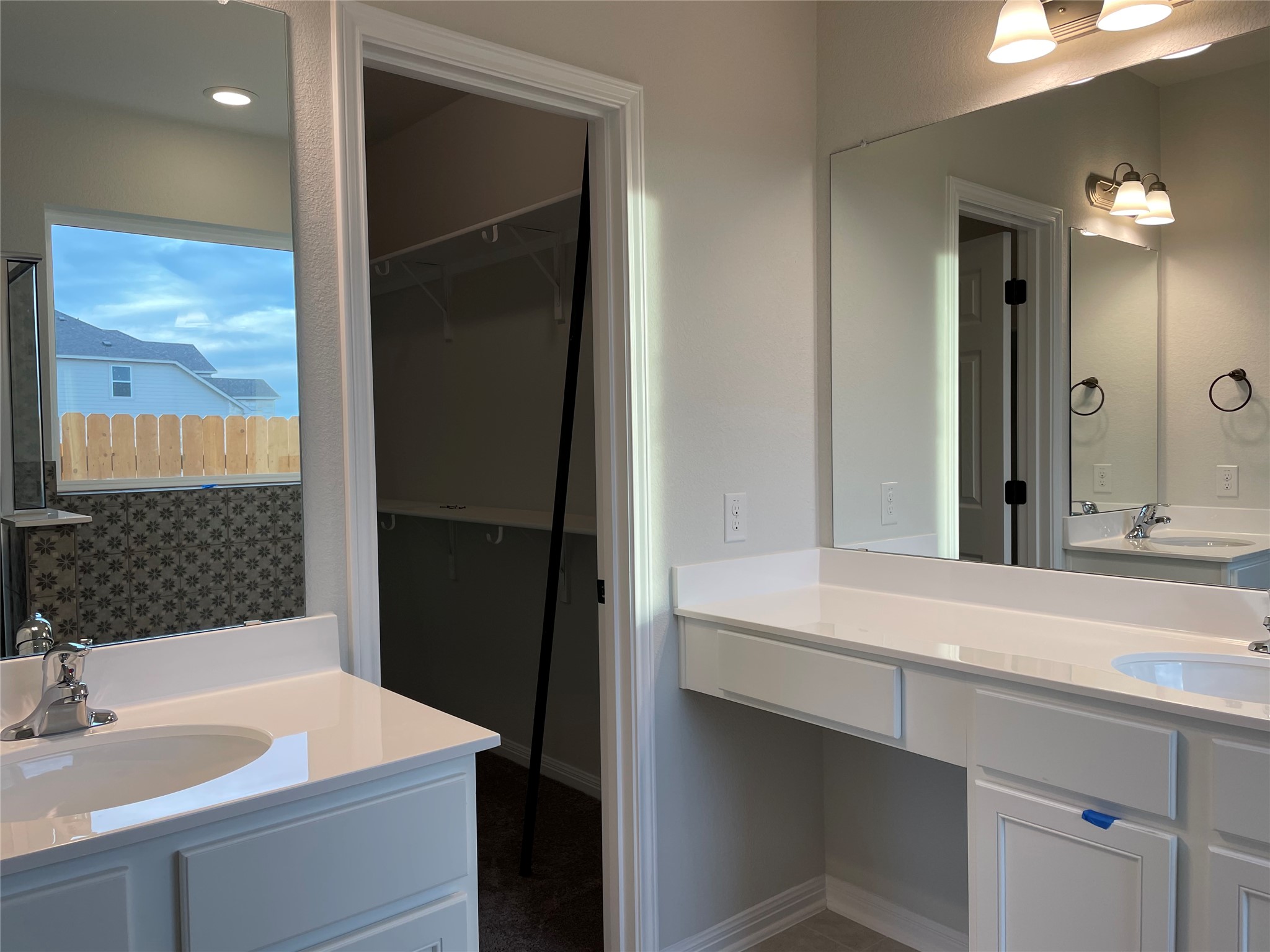 3908 Birdwatch Loop, Unit 56 Pflugerville, TX 78660 - Photo 22 of 30 a bathroom with a sink and a mirror