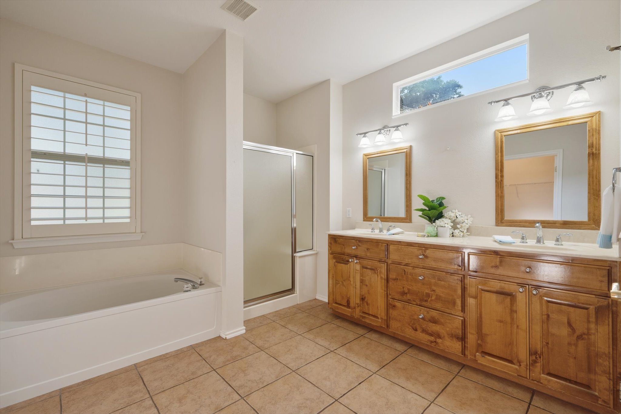 126 Trail Rider Way Georgetown, TX 78633 - Photo 17 of 30 a spacious bathroom with a tub sink and mirror