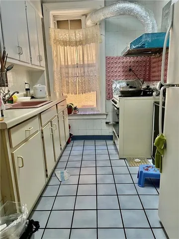 a bathroom with a sink a toilet and a shower