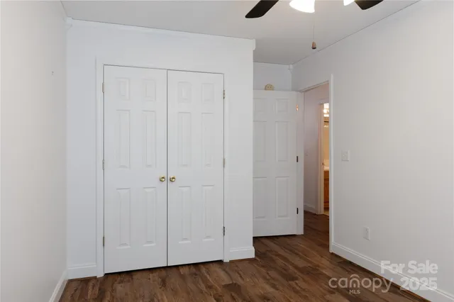 a view of a livingroom with wooden floor