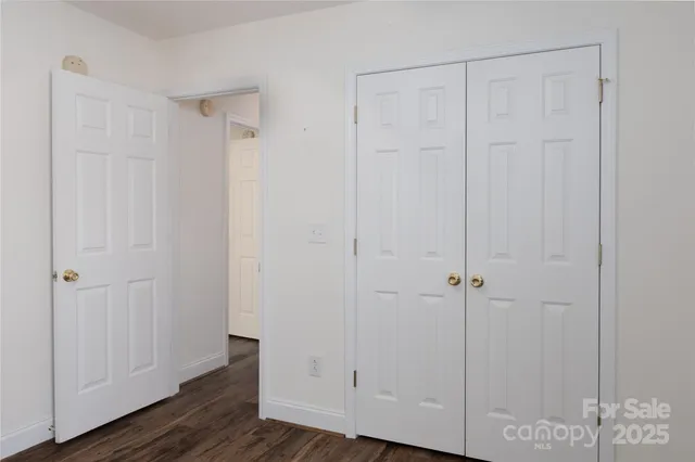 a view of room with hardwood floor