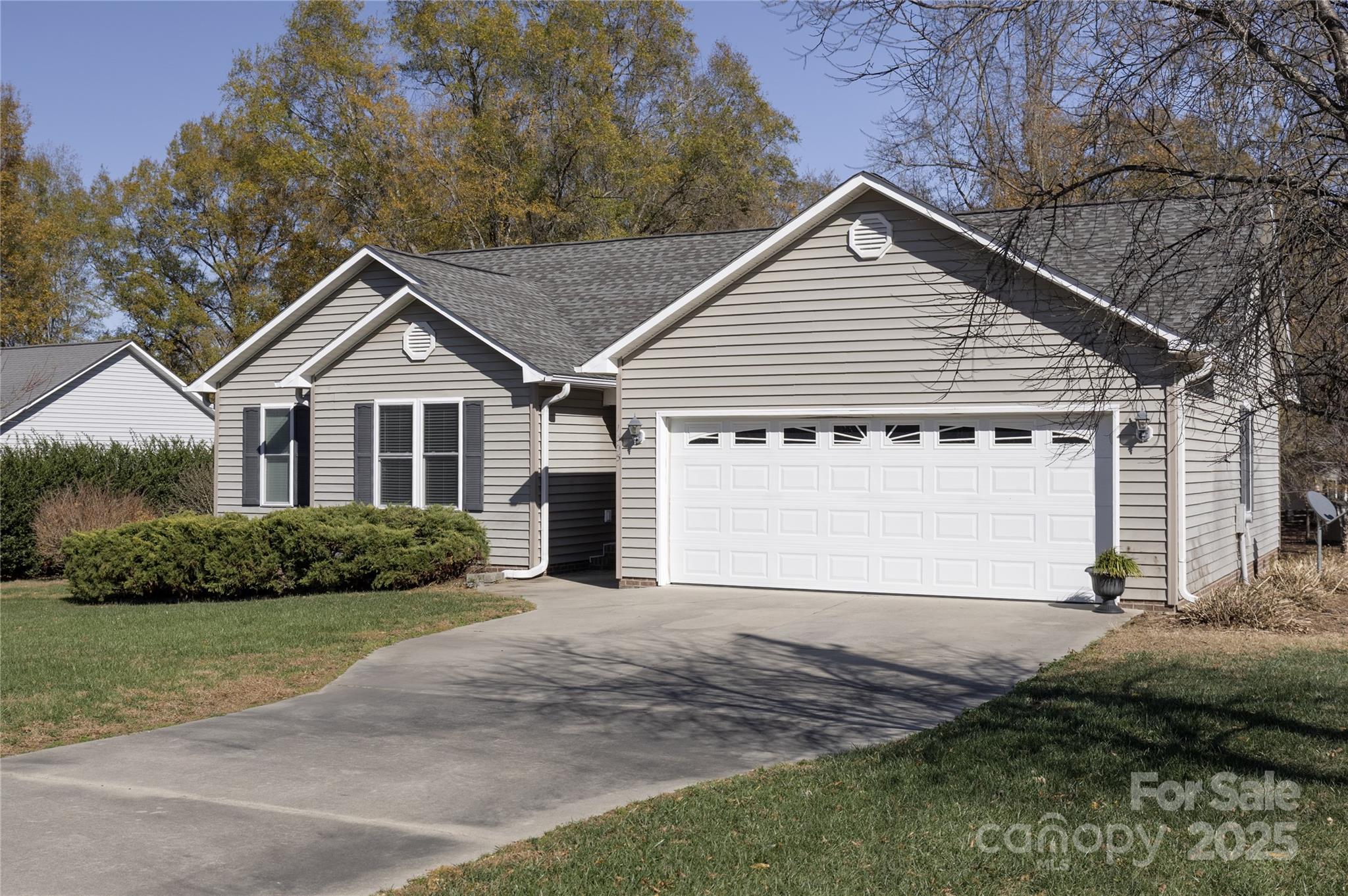 1505 Moss Springs Road Albemarle, NC 28001 - Photo 2 of 26 a front view of a house with a garden and yard